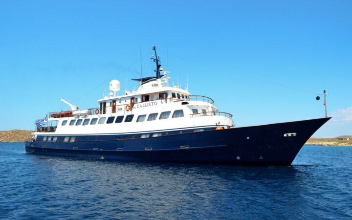 The Callisto Mediterranean yacht with a blue hull seen at its port side.