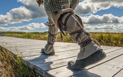Lower legs of an indigenous inhabitant of the Canadian Maritimes wearing reindeer boots.