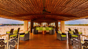 A open air lounge featuring beautiful wood finishes and comfortable seating arrangements to take in the scenery as you sail