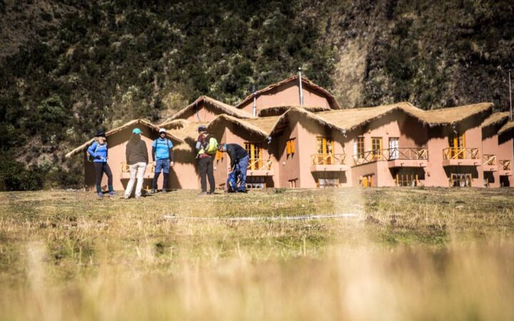 A group of trekkers stand outside the Salkantay Lodge and Adventure Resort, one of four hotels that are part of the Mountain Lodges of Peru on the Inca Trail to Machu Picchu