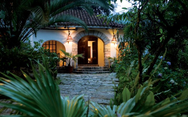 The arched entrance to the Inkaterra Machu Picchu Pueblo Hotel, a National Geographic Unique Lodge of the World in the Andes with 83 whitewashed adobe casitas tucked away in the cloud forest.
