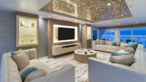 The main lounge features comforts and a stunning view of the beauty of the Galapagos while cruising aboard the Elite