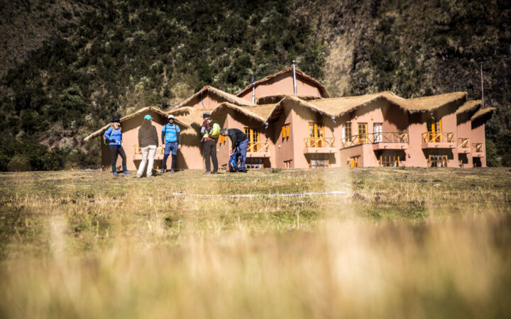 A group of trekkers stand outside the Salkantay Lodge and Adventure Resort, one of four hotels that are part of the Mountain Lodges of Peru on the Inca Trail to Machu Picchu
