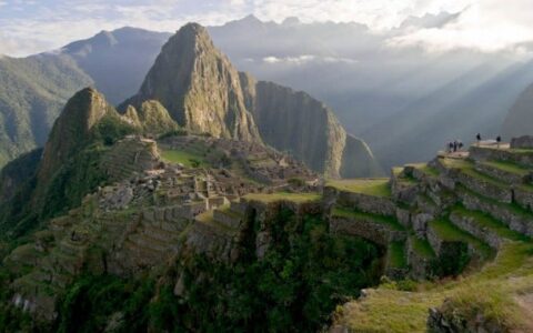 approaching machu picchu on salkantay trek land tour