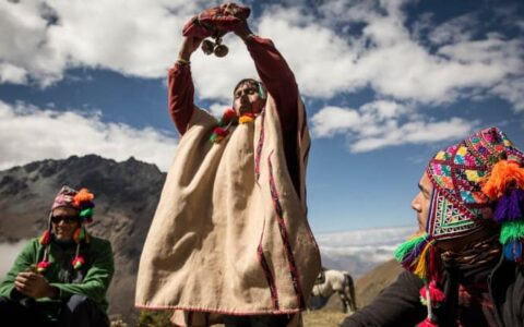 local spiritual leader performing blessing on salkantay trek to machu picchu