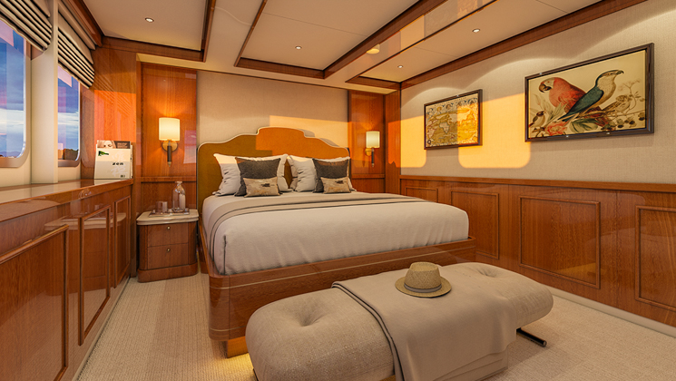Suite #101 on Aqua Lares superyacht with double bed, beige carpet, wood panels, framed artwork, view windows & accent lights.