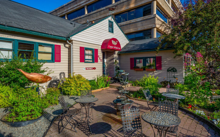 The front of a small hotel, Copper Whale Inn on a sunny day in anchorage Alaska