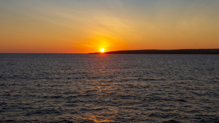 Sunset aboard small ship cruise Grand Ocean Spray Catamaran