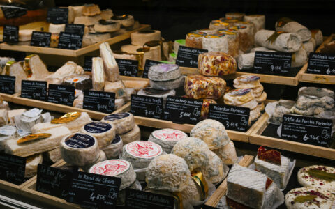 Case of various fine French cheeses, seen at a market on the Traversing the Med: A Mediterranean Feast small ship cruise.