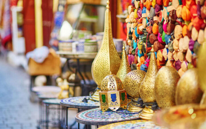 Colorful market wares of gold, stone tile and woven goods at a Morocco market, seen on the Mediterranean Feast cruise.
