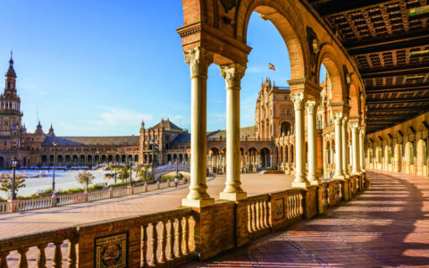 Arched walkway at the Seville plaza in Spain on a bright sunny day