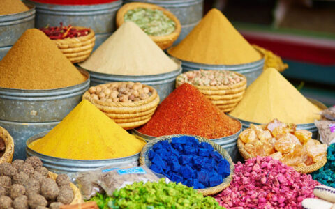 Selection of colorful spices on a traditional Moroccan market in Marrakech, Morocco