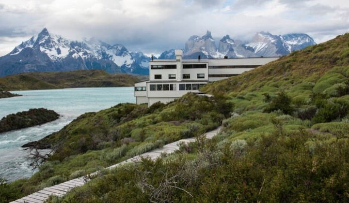Exterior of Explora Torres del Paine Lodge in Chile, placed among mountains on the shores of Lake Pehoe
