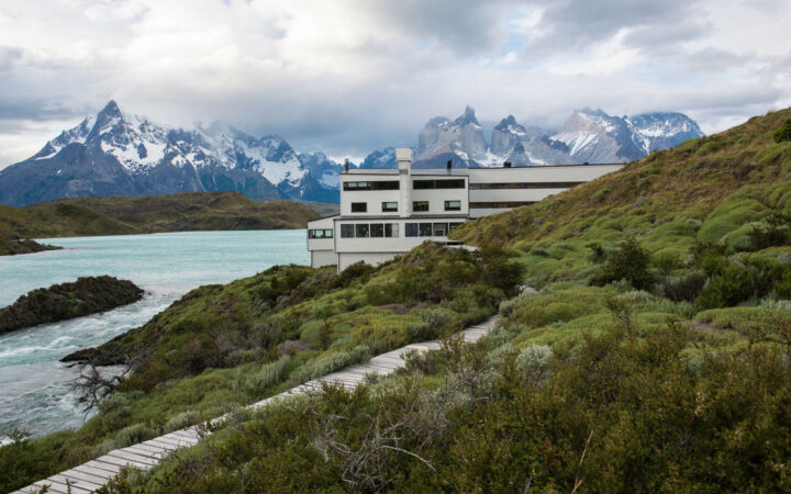Exterior of Explora Torres del Paine Lodge in Chile, placed among mountains on the shores of Lake Pehoe