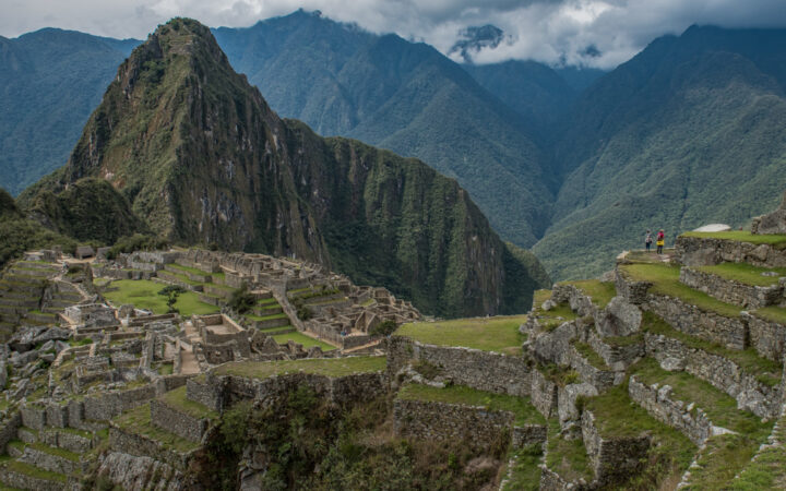 View onto Machu Picchu, down terraced rows of grass & stone, on the Explora Sacred Valley adventure in Peru.