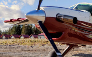 propeller of small aircraft on the shore off of bear camp alaska on a sunny day