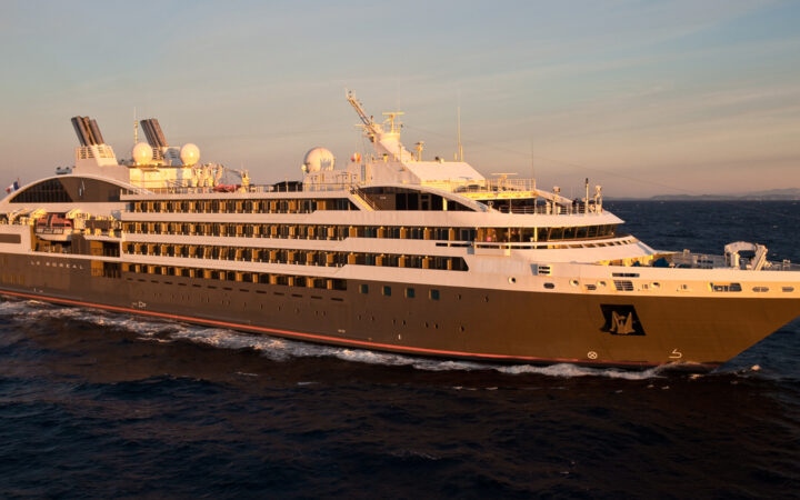 Exterior of expedition ship Le Boreal with 6 passenger decks & gray hull