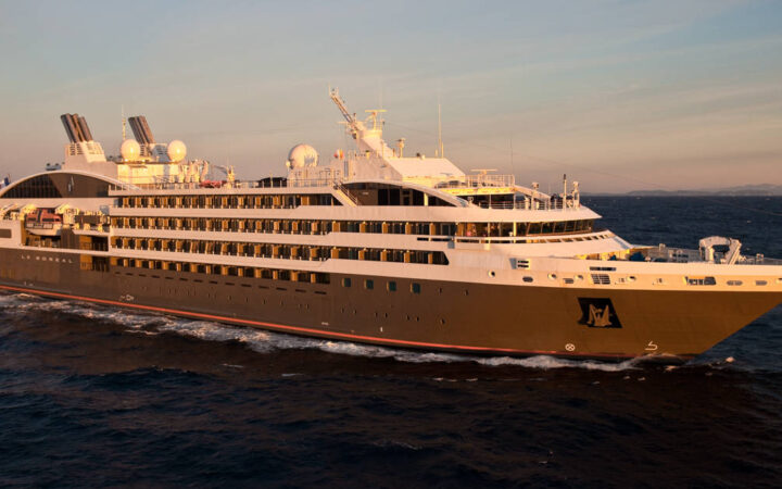 Exterior of expedition ship Le Boreal with 6 passenger decks & gray hull