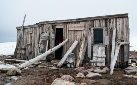 A hut left in the desolation in North Spitsbergen highlighting the harsh winters experienced here.