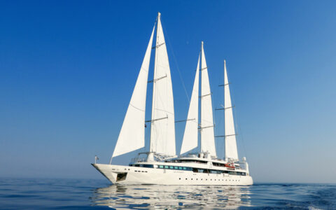 3-masted white motorsailer Le Ponant with 5 sails unfurled cruises calm seas on a sunny day of the Croatia Under Sail cruise.