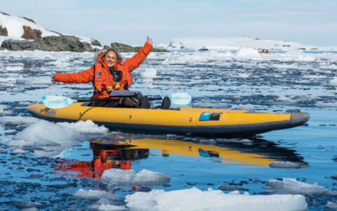 Here we see an adventurer kayaking while cruising on the National Geographic Antarctica, South Georgia and The Falklands cruise