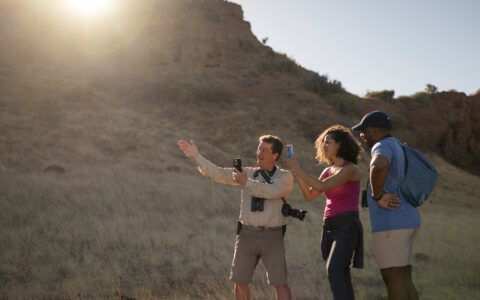 Rich Reid with Guest teaching them how to take better photos with an dslr and Iphone