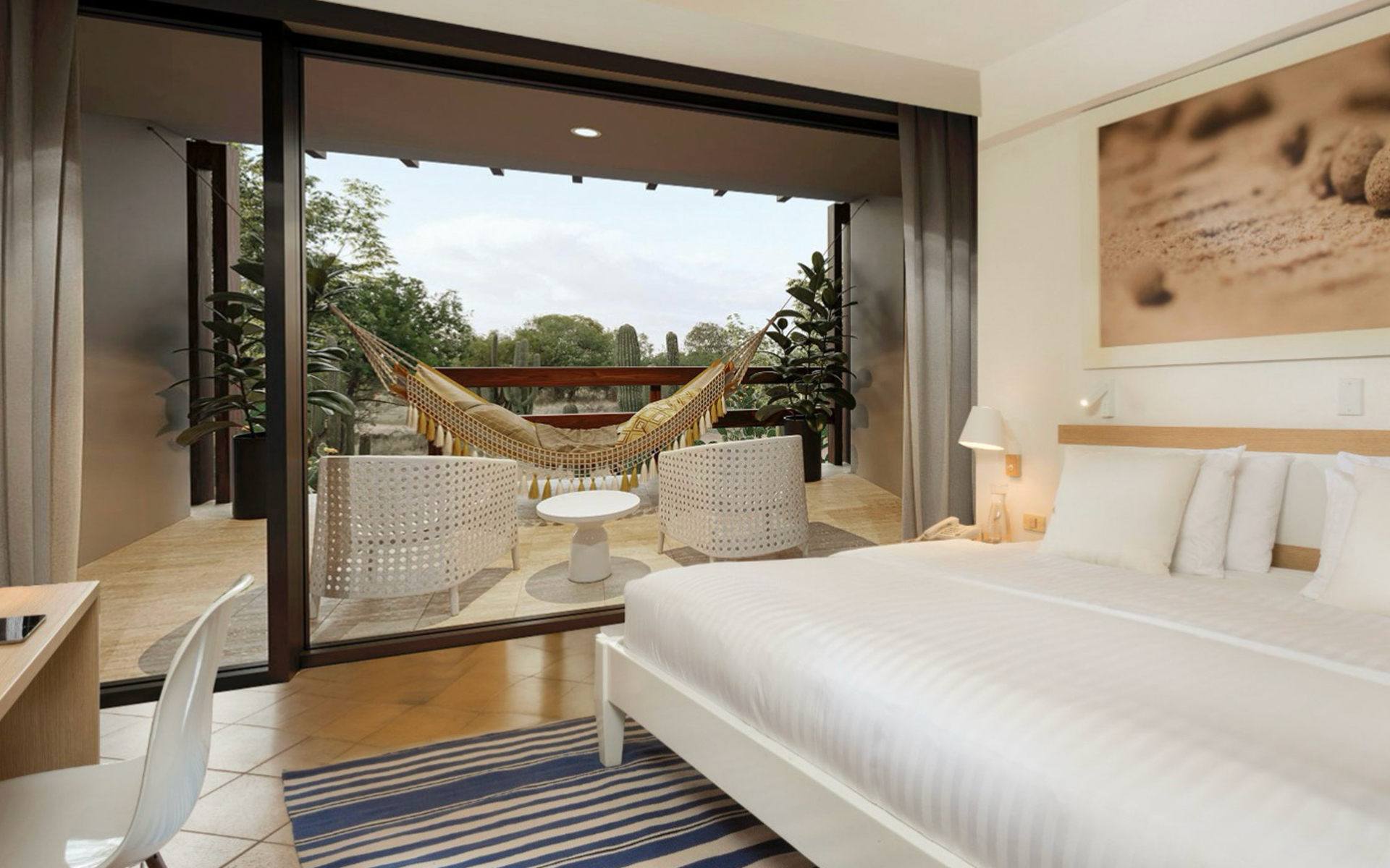 Premium Room at Finch Bay Hotel in Ecuador with king bed in white linens, private deck with hammock, wood desk & glass wall.