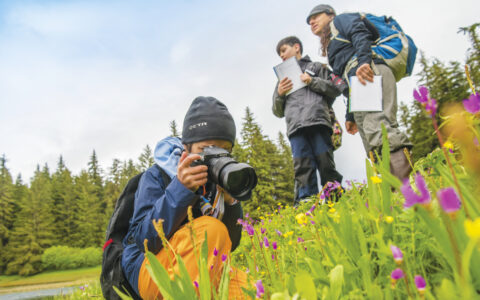 Kids working on Global Explorers field notebook on the Lake Eva Trail in SE Alaska.