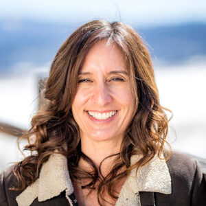 adventuresmith explorations chief financial officer lisa exley-smith smiling with bright snow behind her